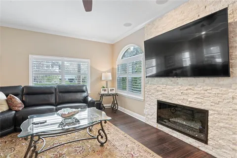 a kitchen with stainless steel appliances kitchen island granite countertop a sink and cabinets