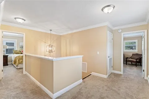 a bathroom with a granite countertop sink a vanity and a window