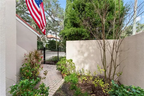 a view of a balcony with yard
