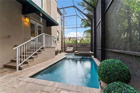 a view of backyard with plants and trees