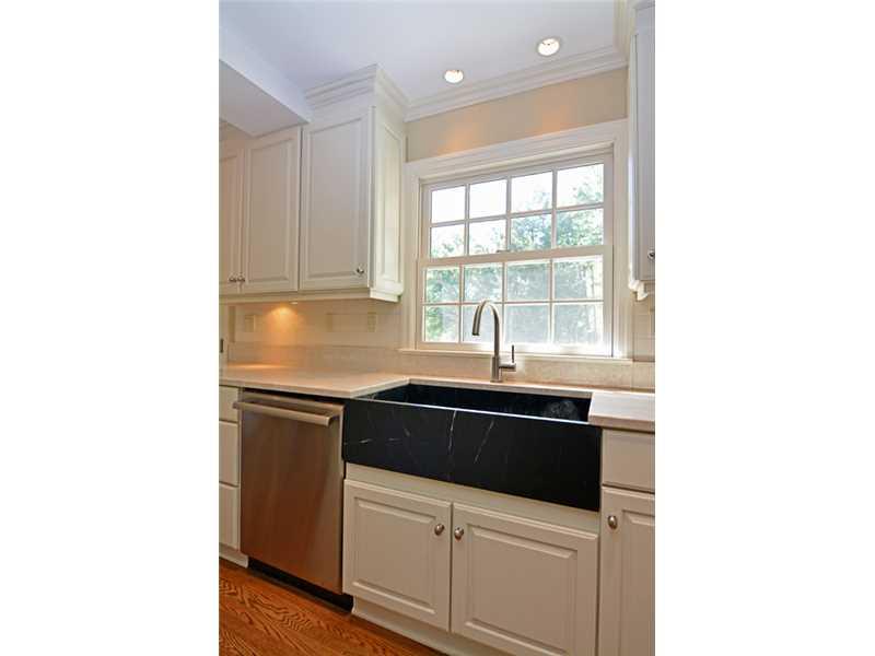 377 Fox Chapel Road Fox Chapel, PA 15238 - Photo 12 of 25 Kitchen. A striking farmhouse sink sits next to the high-end Thermador stainless steel dishwasher.