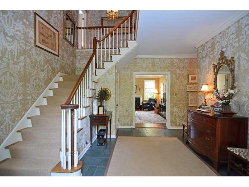 377 Fox Chapel Road Fox Chapel, PA 15238 - Photo 4 of 25 Entry/Foyer. The spacious entry sets and elegant tone for the home, featuring slate tile flooring, crown molding and a grand staircase to the upper level. The entry adjoins the living room, family room and dining room.