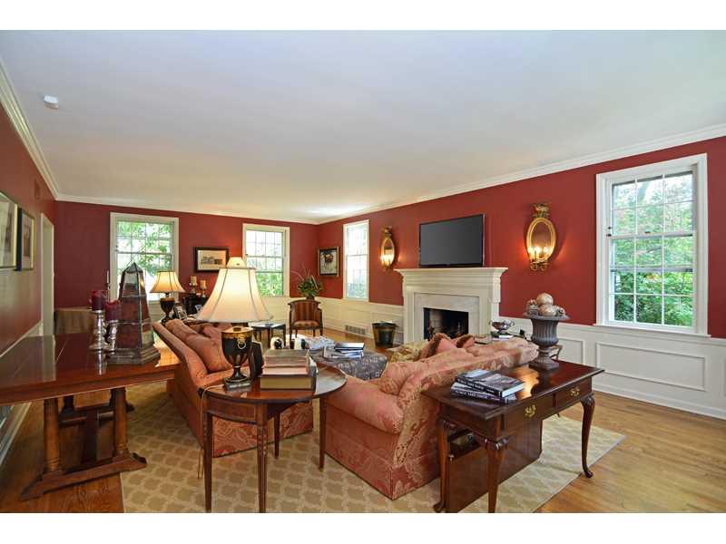377 Fox Chapel Road Fox Chapel, PA 15238 - Photo 5 of 25 Living Room. Oak hardwood underscores the large living room, also featuring a marble fireplace, stylish wainscoting and crown molding.