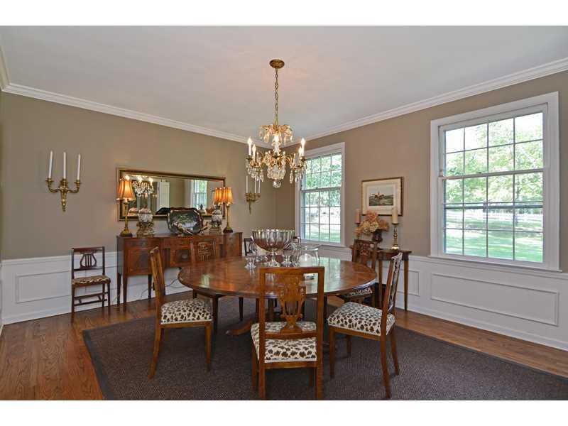 377 Fox Chapel Road Fox Chapel, PA 15238 - Photo 6 of 25 Dining Room. Elegance abounds in the formal dining room, adorned with a crystal chandelier, wainscoting, and crown molding.