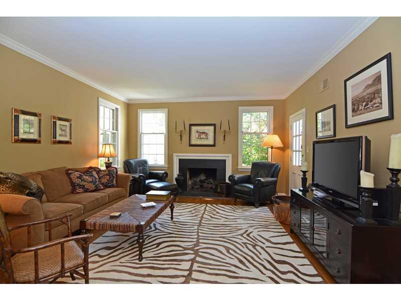 377 Fox Chapel Road Fox Chapel, PA 15238 - Photo 7 of 25 Family Room. Warm and inviting, the family room offers a fireplace, built-in bookcase and walkout to the rear patio.