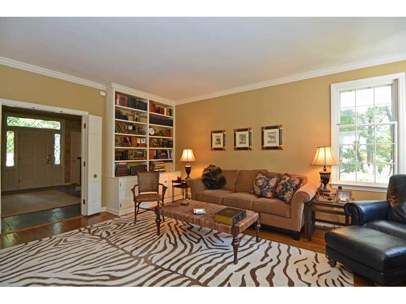 377 Fox Chapel Road Fox Chapel, PA 15238 - Photo 8 of 25 Family Room. The oak hardwood family room sports a built-in bookcase with cabinet storage, plus crown molding.