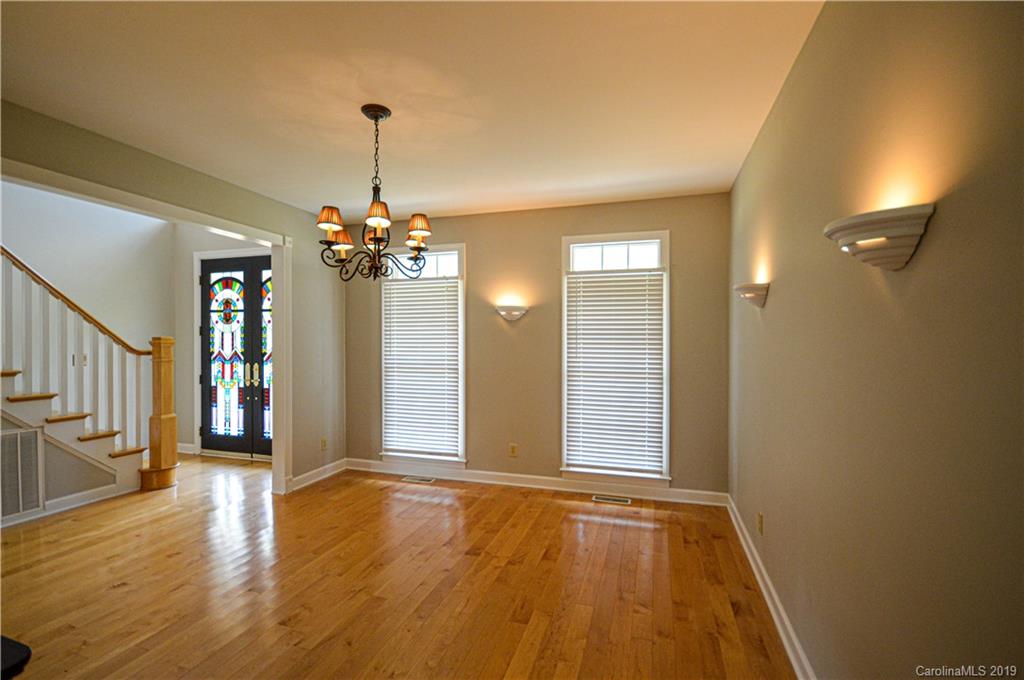 2500 Old Pardue Road Lancaster, SC 29720 - Photo 8 of 39 a view of a livingroom with wooden floor and a chandelier