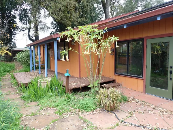 a front view of a house with garden