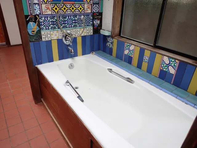 an entryway with wooden floor and cabinet