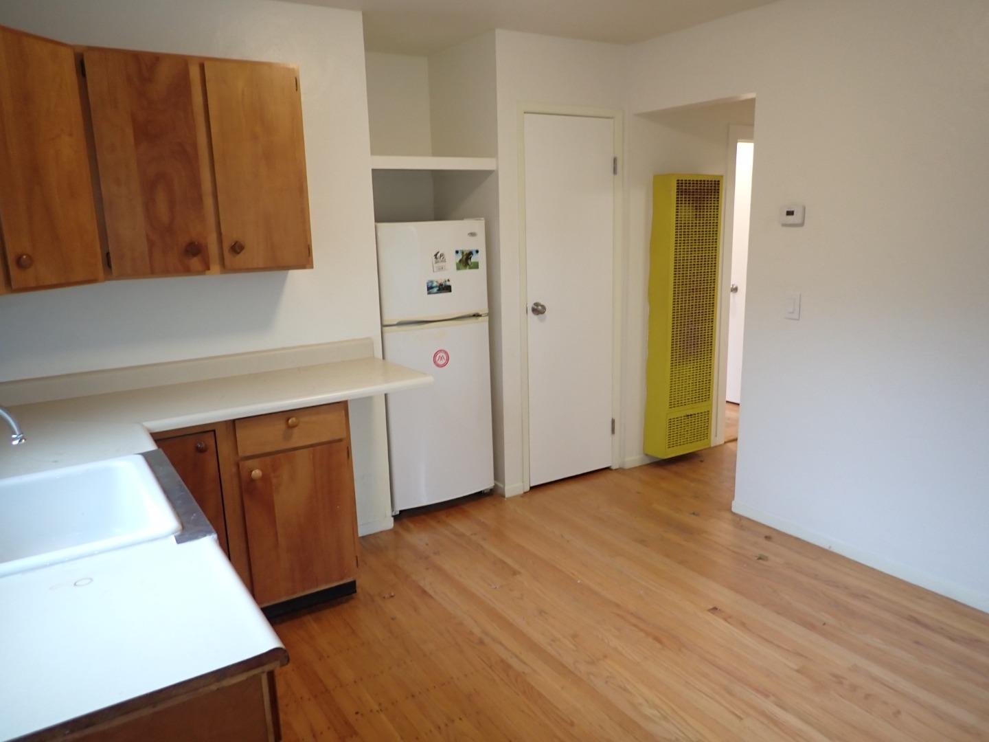 18039 Riverside Drive Sonoma, CA 95476 - Photo 18 of 21 an entryway with wooden floor and cabinet