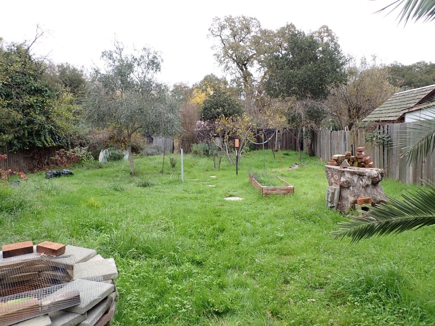 18039 Riverside Drive Sonoma, CA 95476 - Photo 21 of 21 a backyard of a house with barbeque oven and outdoor seating