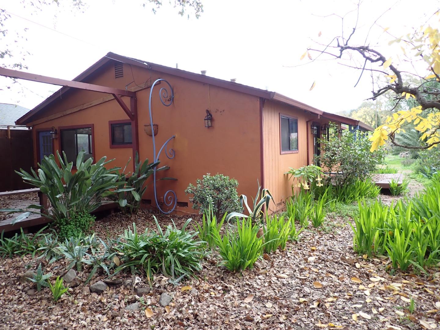 18039 Riverside Drive Sonoma, CA 95476 - Photo 3 of 21 a front view of a house with garden