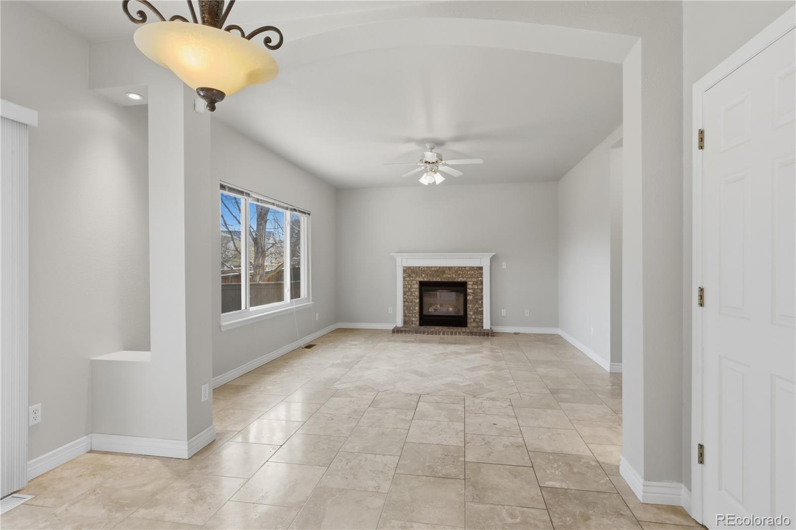 3807 Garnet Way Highlands Ranch, CO 80126 - Photo 15 of 38 a view of an empty room with a window