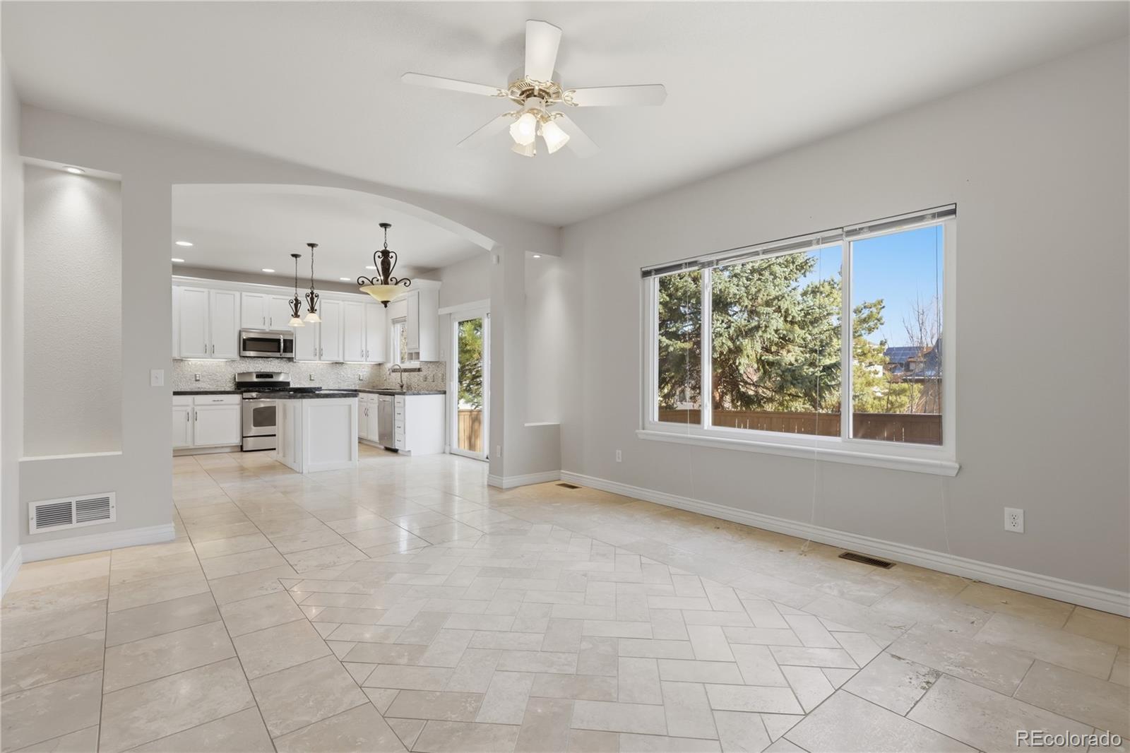 3807 Garnet Way Highlands Ranch, CO 80126 - Photo 17 of 38 a view of kitchen with furniture and window