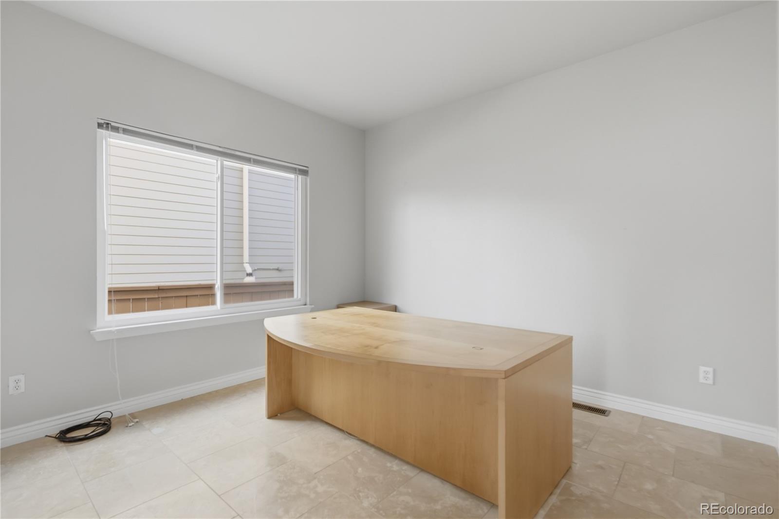 3807 Garnet Way Highlands Ranch, CO 80126 - Photo 18 of 38 a room with a bed and a window