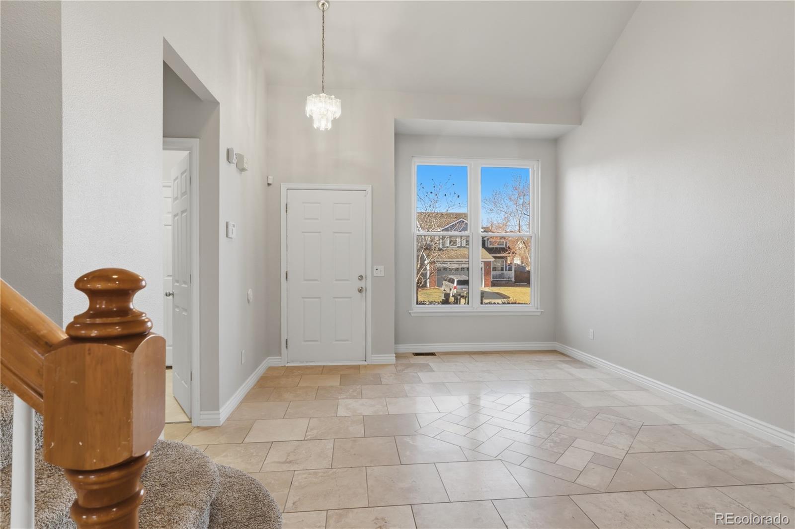3807 Garnet Way Highlands Ranch, CO 80126 - Photo 2 of 38 a view of entryway with livingroom