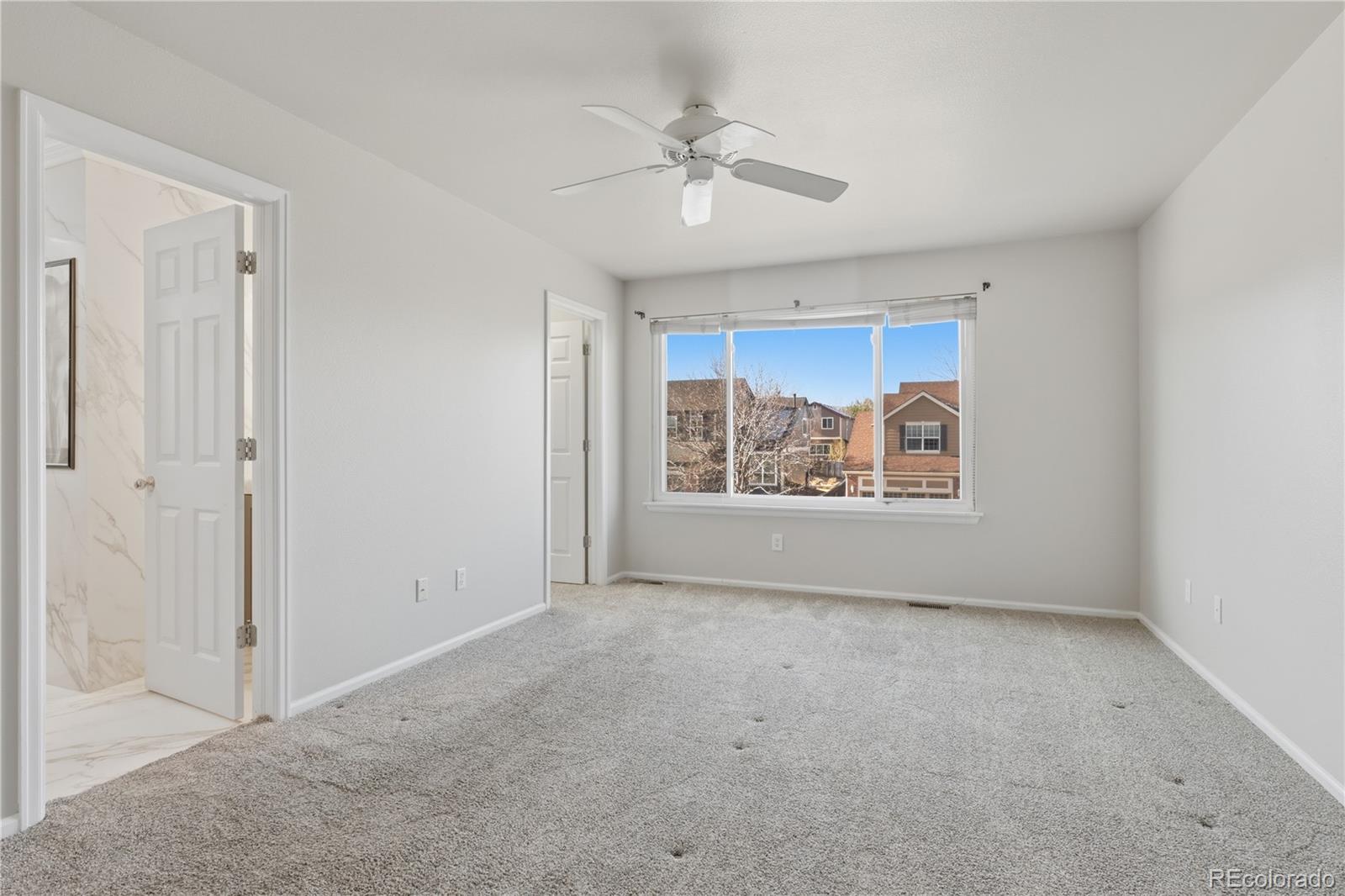 3807 Garnet Way Highlands Ranch, CO 80126 - Photo 21 of 38 a view of an empty room with a window