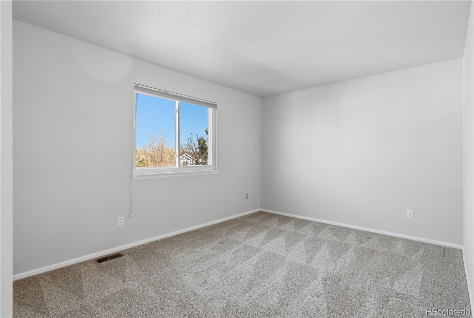 3807 Garnet Way Highlands Ranch, CO 80126 - Photo 29 of 38 a view of an empty room with a window