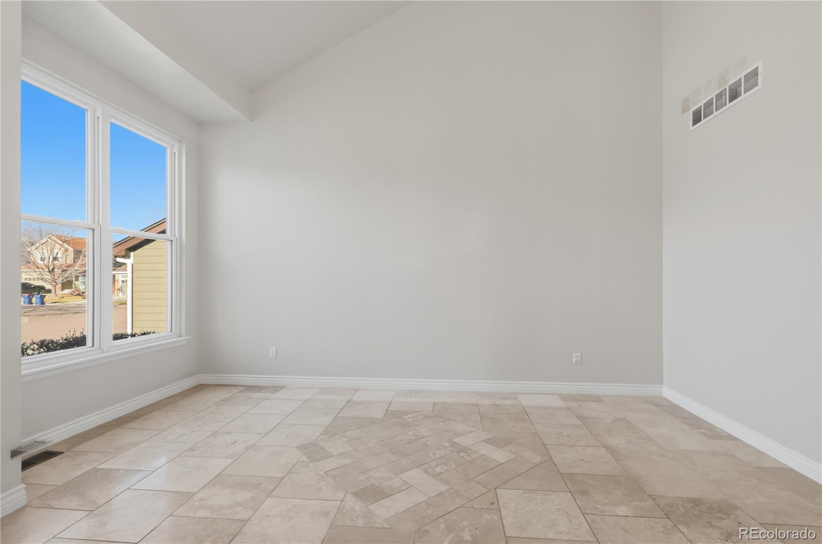 3807 Garnet Way Highlands Ranch, CO 80126 - Photo 3 of 38 a view of an empty room and window