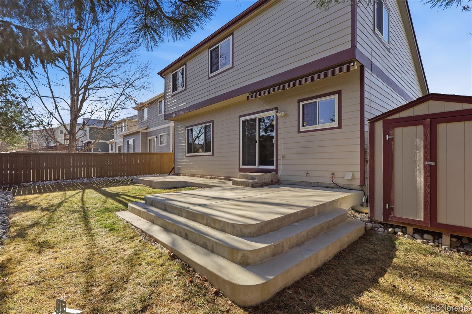 3807 Garnet Way Highlands Ranch, CO 80126 - Photo 34 of 38 a view of a house with snow on roof