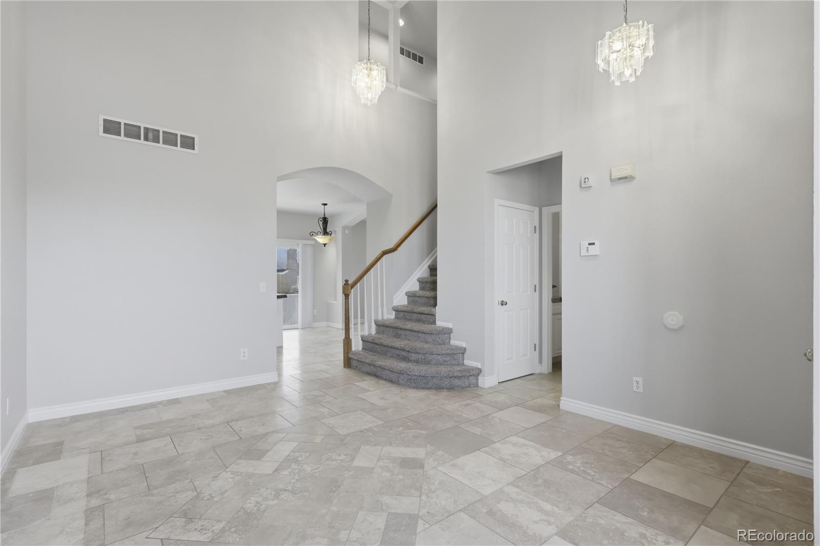 3807 Garnet Way Highlands Ranch, CO 80126 - Photo 4 of 38 a view of entryway and hall