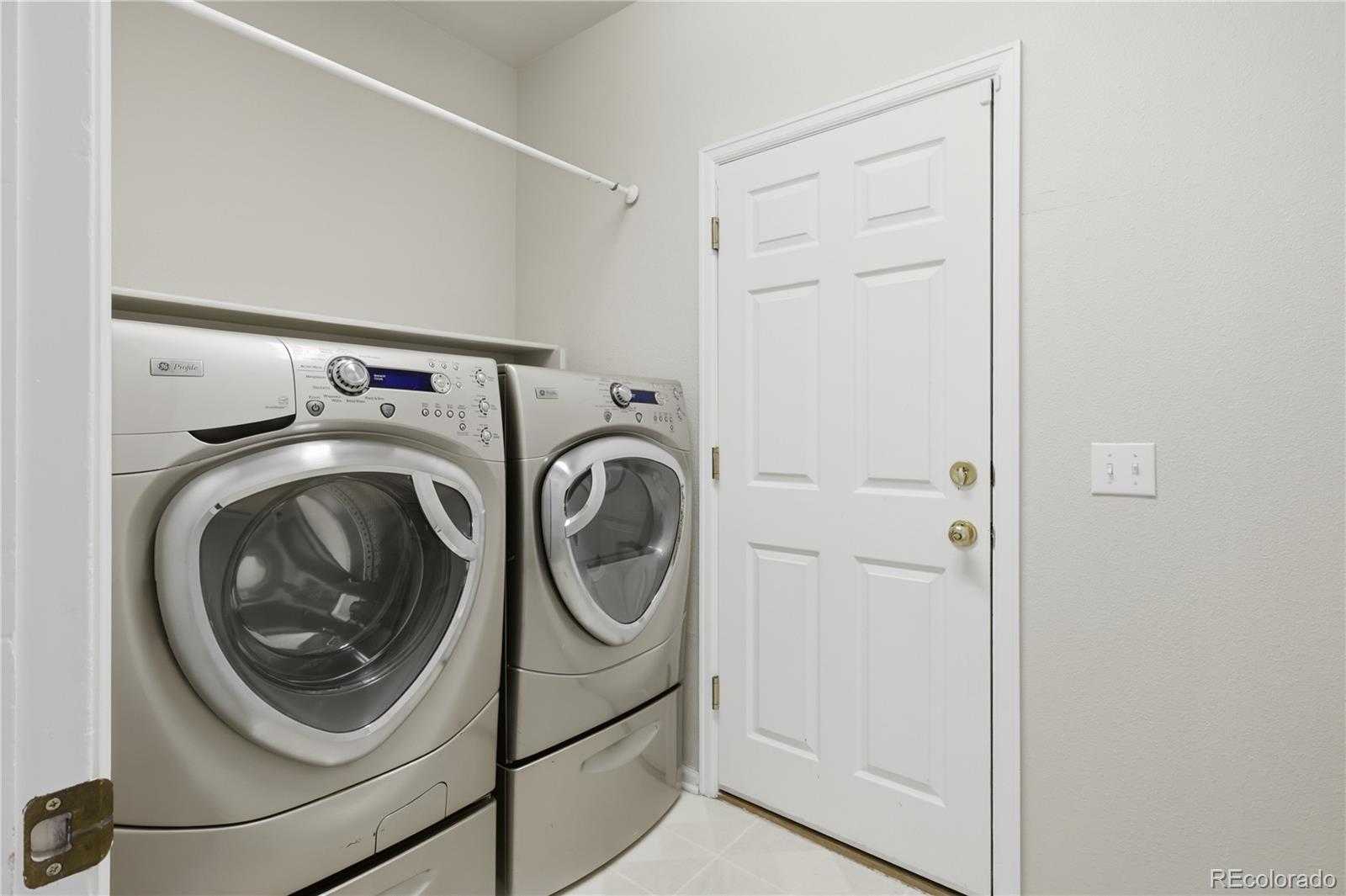 3807 Garnet Way Highlands Ranch, CO 80126 - Photo 5 of 38 a utility room with dryer and washer