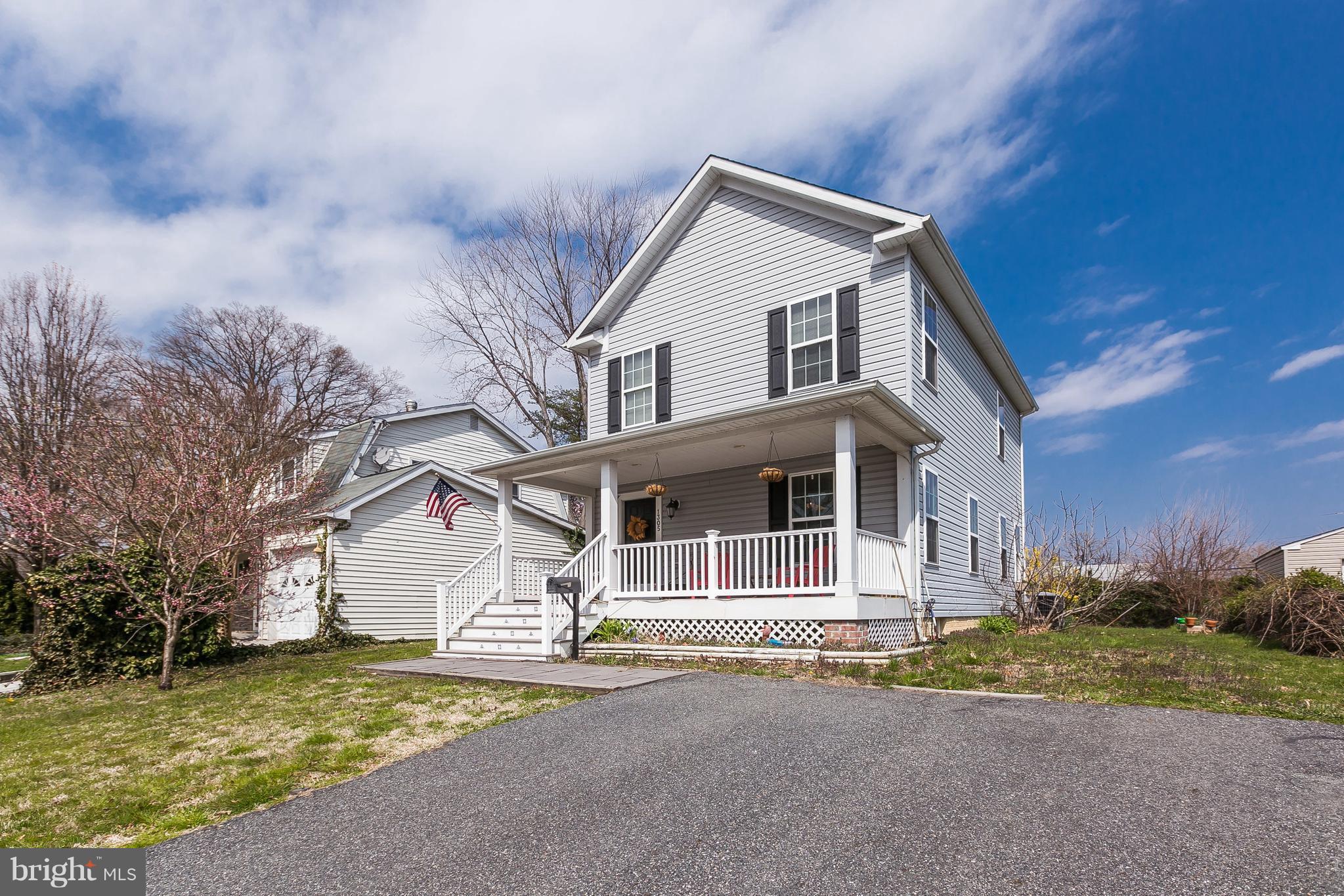 1305 3rd Road Baltimore, MD 21220 - Photo 1 of 27 a front view of a house with a yard