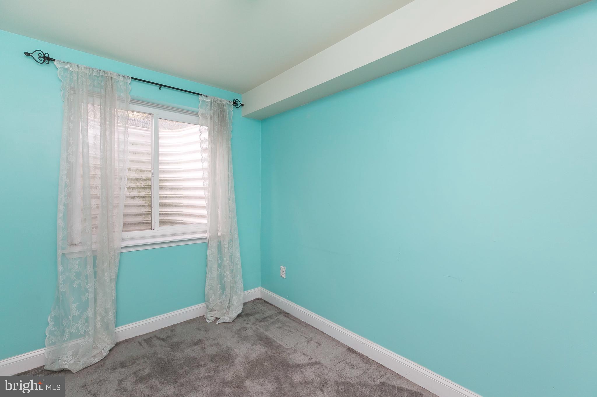 1305 3rd Road Baltimore, MD 21220 - Photo 22 of 27 a view of an empty room with a window