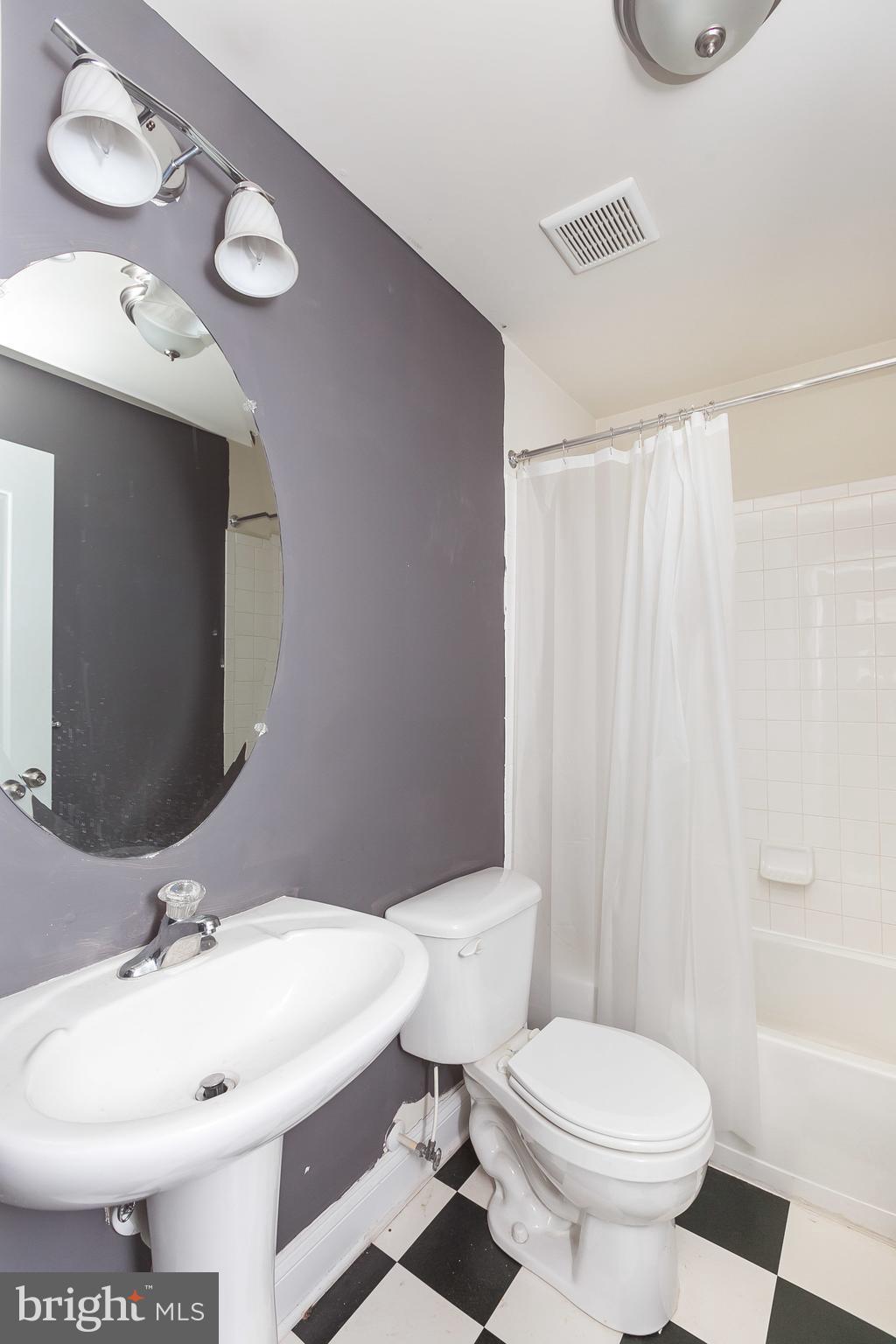 1305 3rd Road Baltimore, MD 21220 - Photo 24 of 27 a bathroom with a sink toilet and shower