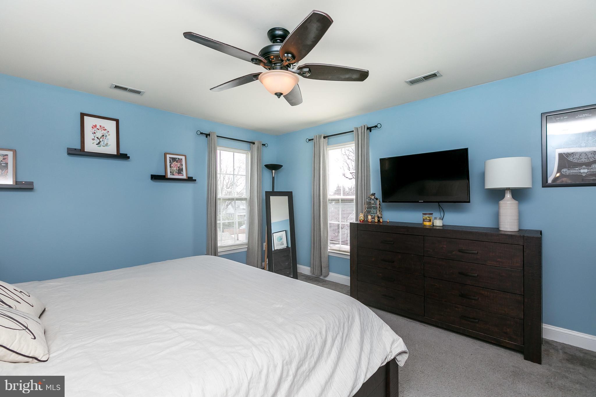 1305 3rd Road Baltimore, MD 21220 - Photo 5 of 27 a bedroom with a bed and a flat screen tv