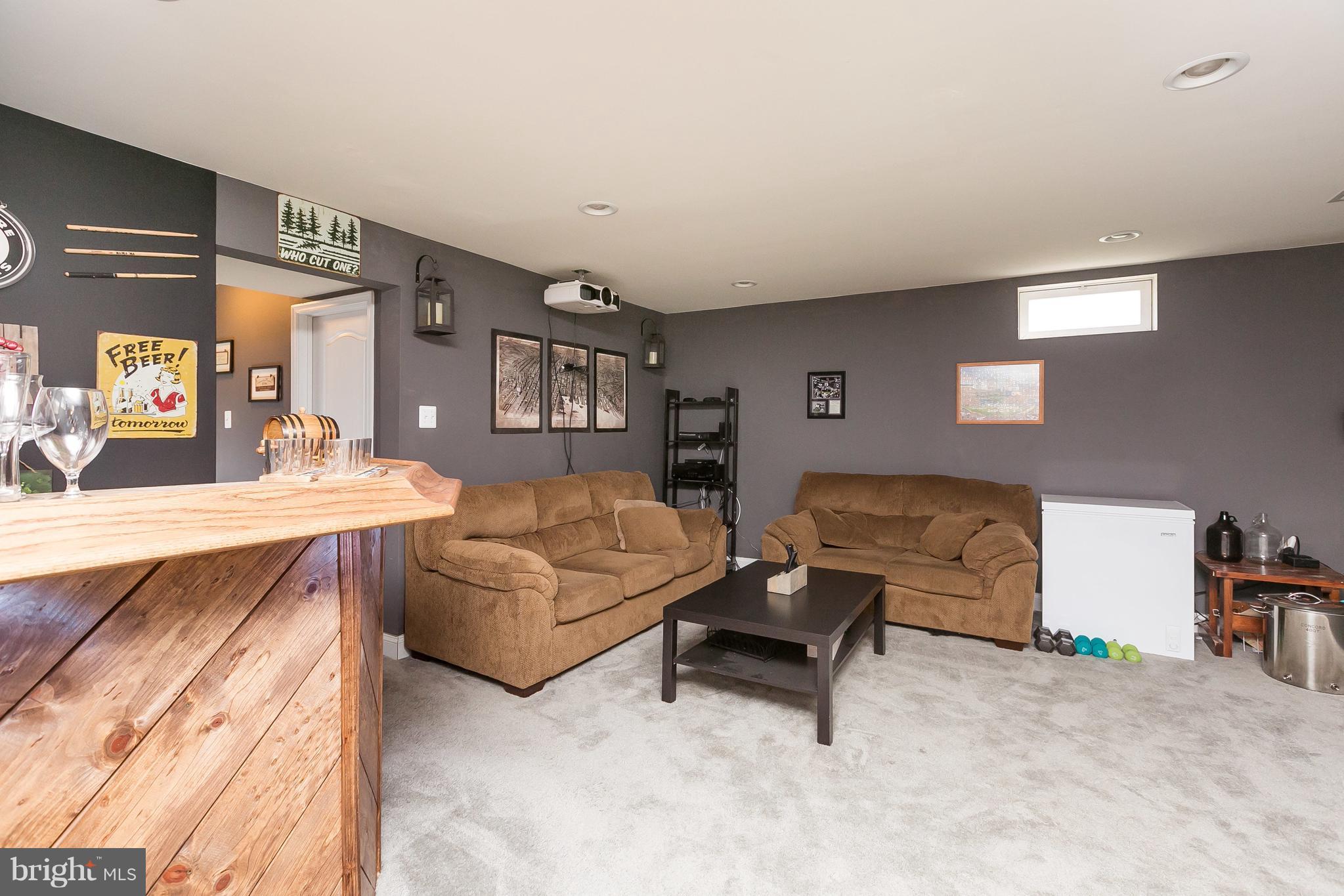 1305 3rd Road Baltimore, MD 21220 - Photo 6 of 27 a living room with furniture and a flat screen tv