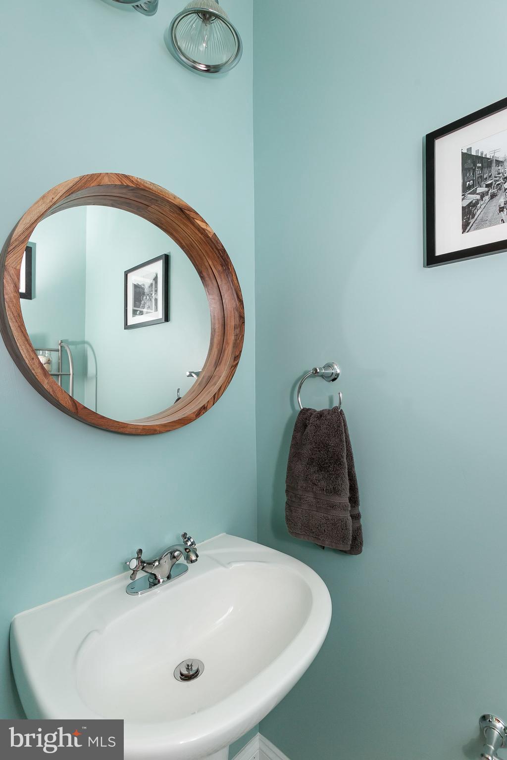 1305 3rd Road Baltimore, MD 21220 - Photo 10 of 27 a bathroom with a sink and mirror