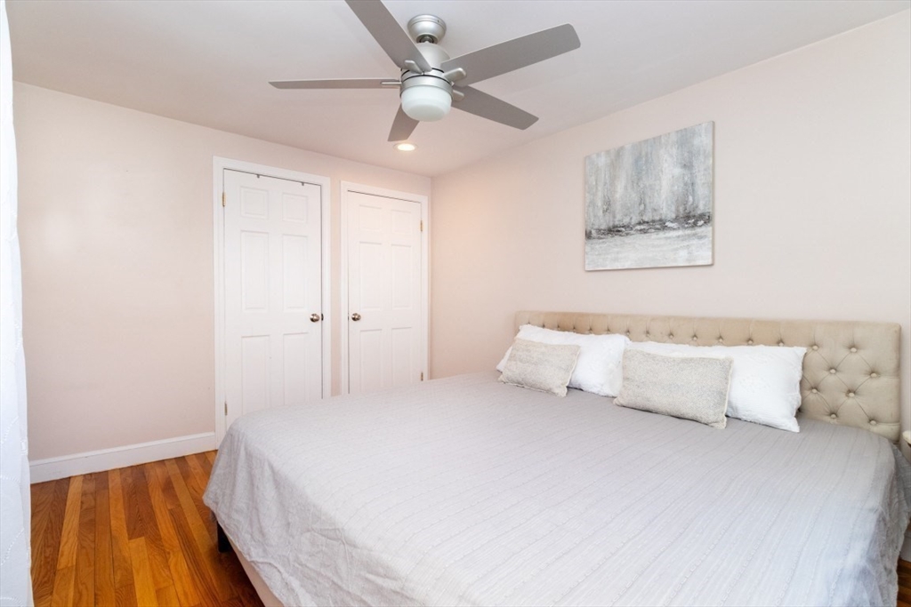 236 Fellsway West Medford, MA 02155 - Photo 19 of 39 a bedroom with a bed and a large window