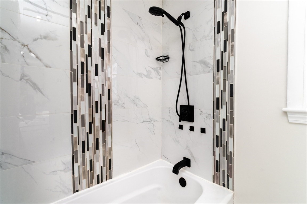 236 Fellsway West Medford, MA 02155 - Photo 27 of 39 a bathroom with a shower and a tub