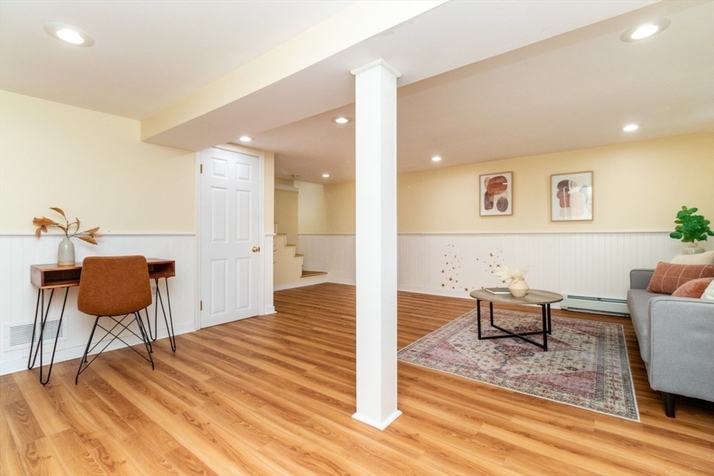 236 Fellsway West Medford, MA 02155 - Photo 31 of 39 a living room with furniture and a wooden floor