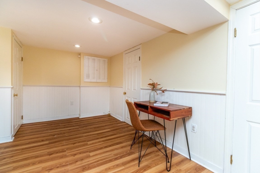 236 Fellsway West Medford, MA 02155 - Photo 33 of 39 a workspace with furniture and wooden floor