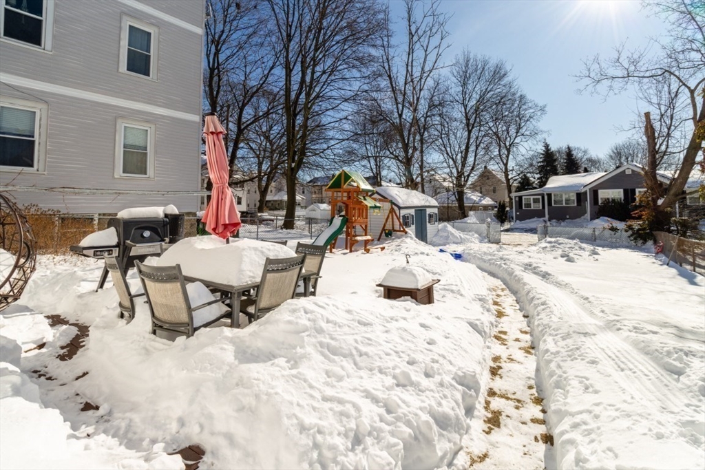 236 Fellsway West Medford, MA 02155 - Photo 36 of 39 a view of a backyard with a large tree