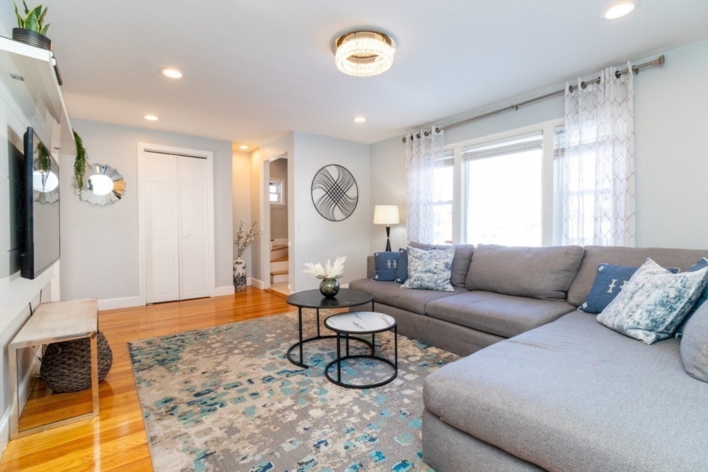 236 Fellsway West Medford, MA 02155 - Photo 6 of 39 a living room with furniture a rug and a flat screen tv