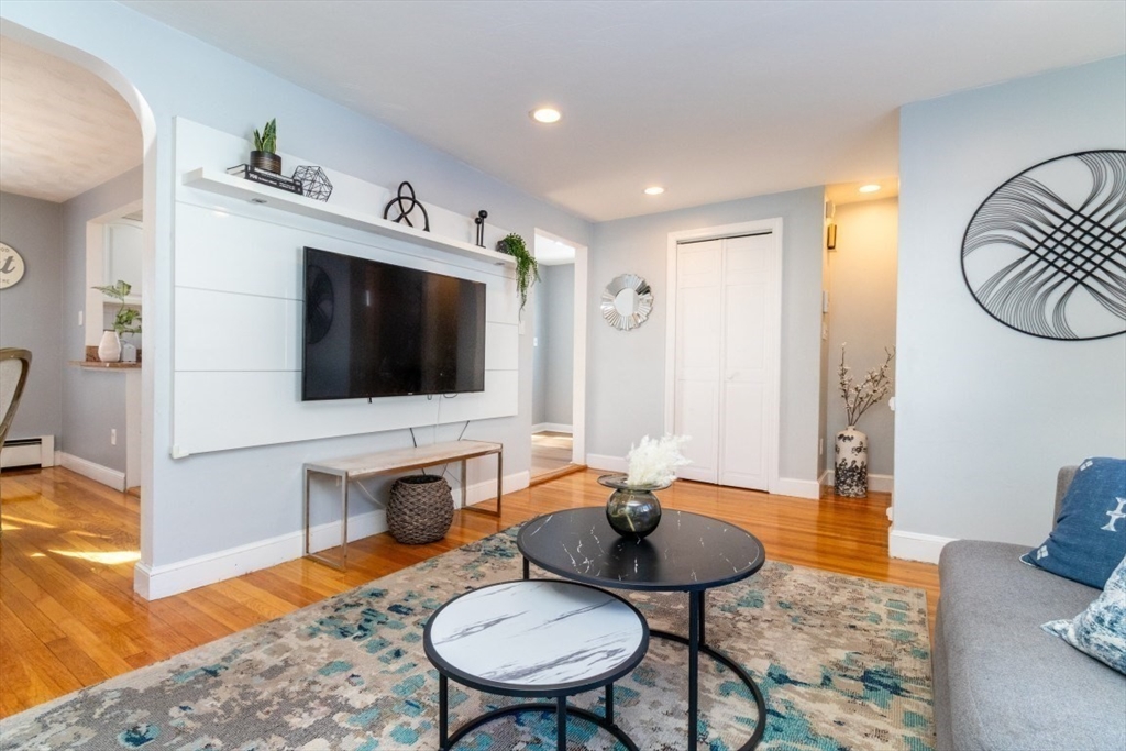 236 Fellsway West Medford, MA 02155 - Photo 7 of 39 a living room with furniture and a flat screen tv