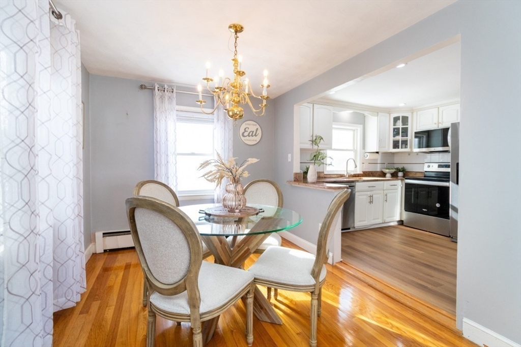 236 Fellsway West Medford, MA 02155 - Photo 8 of 39 a dining room filled chandelier and kitchen view