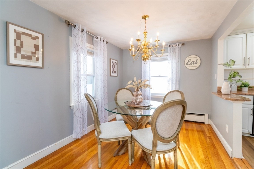 236 Fellsway West Medford, MA 02155 - Photo 9 of 39 a view of a dining room with furniture window and wooden floor