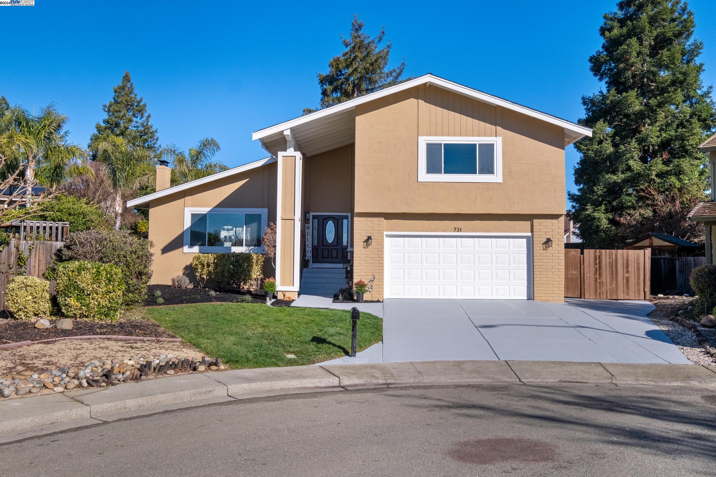 731 Arboles Place San Ramon, CA 94583 - Photo 1 of 1 a front view of a house with a yard and garage