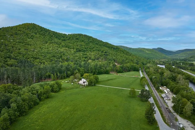a view of a green field with clear sky