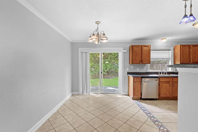 a kitchen with stainless steel appliances granite countertop a sink and a stove top oven