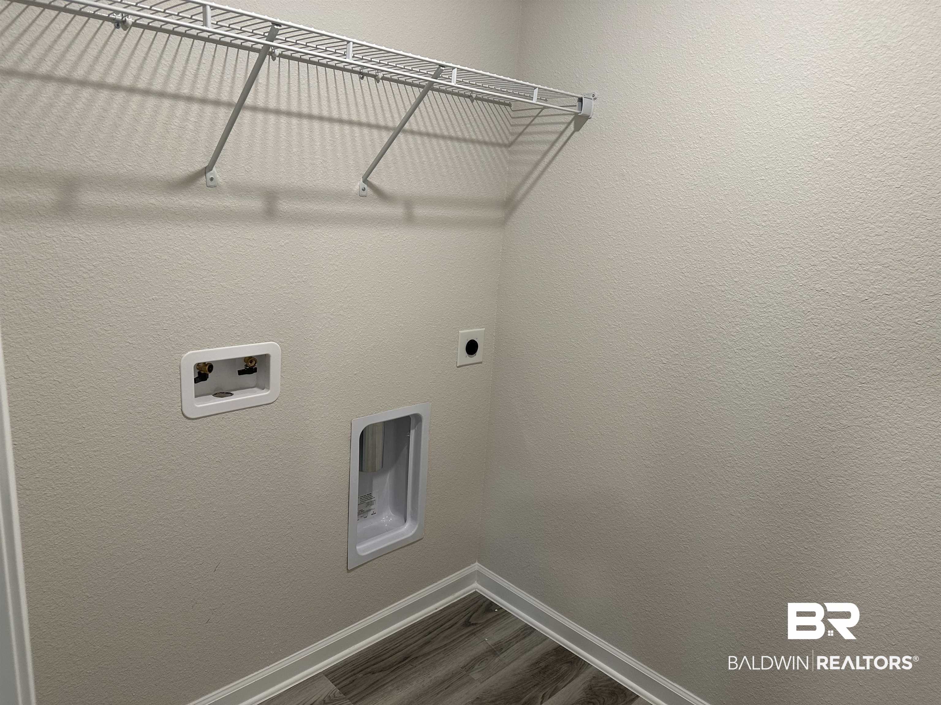 1238 Hayward Loop Foley, AL 36535 - Photo 19 of 46 Laundry room with hookup for an electric dryer, wood-type flooring, and washer hookup