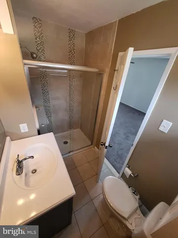 a bathroom with a toilet and a sink