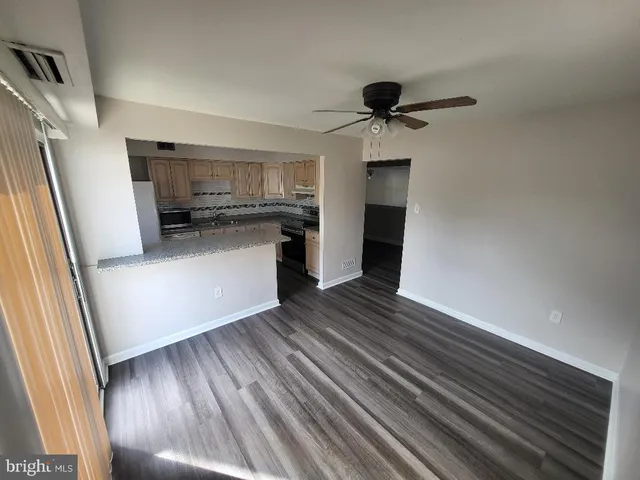 a kitchen with a refrigerator and a stove