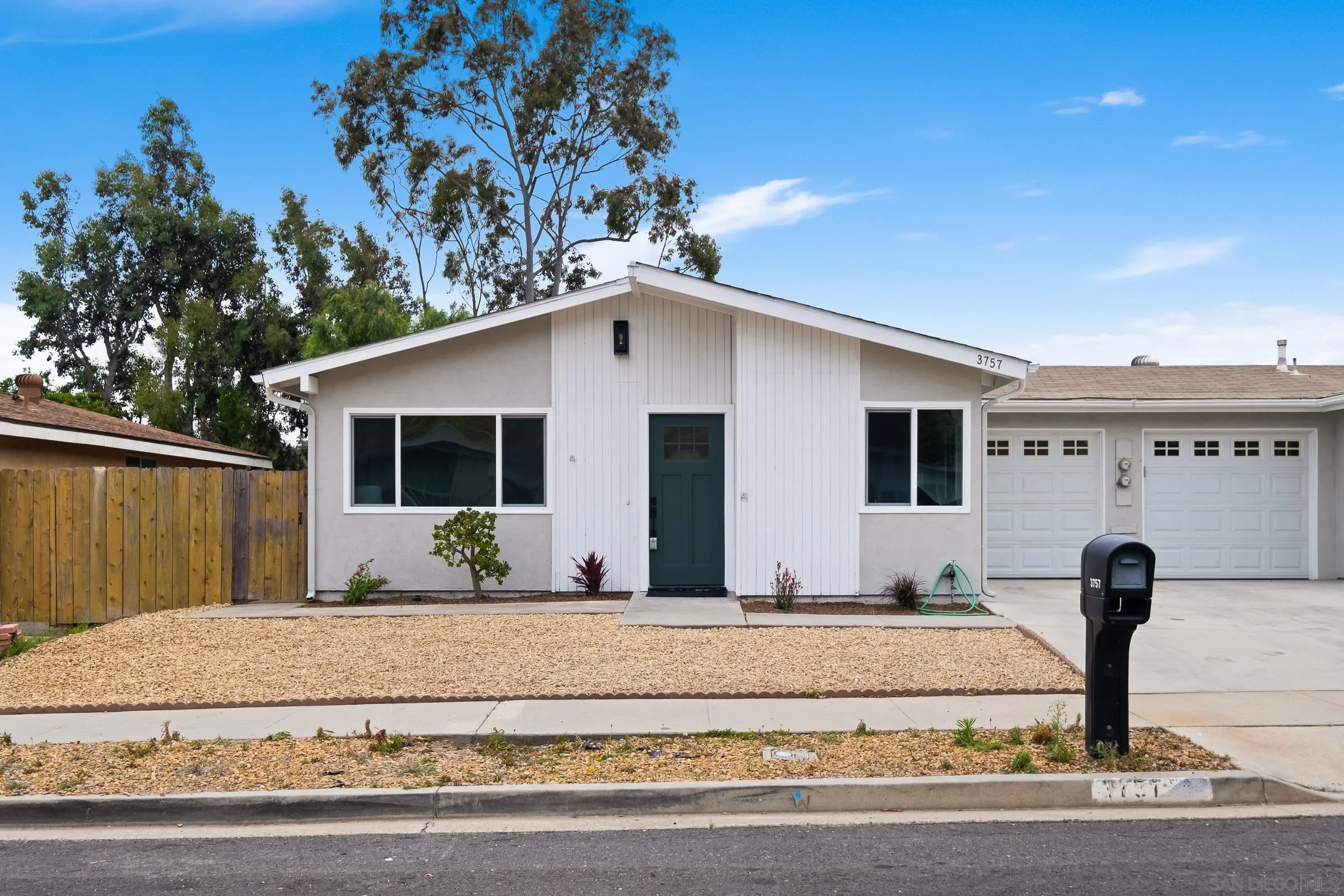 a front view of a house with a porch