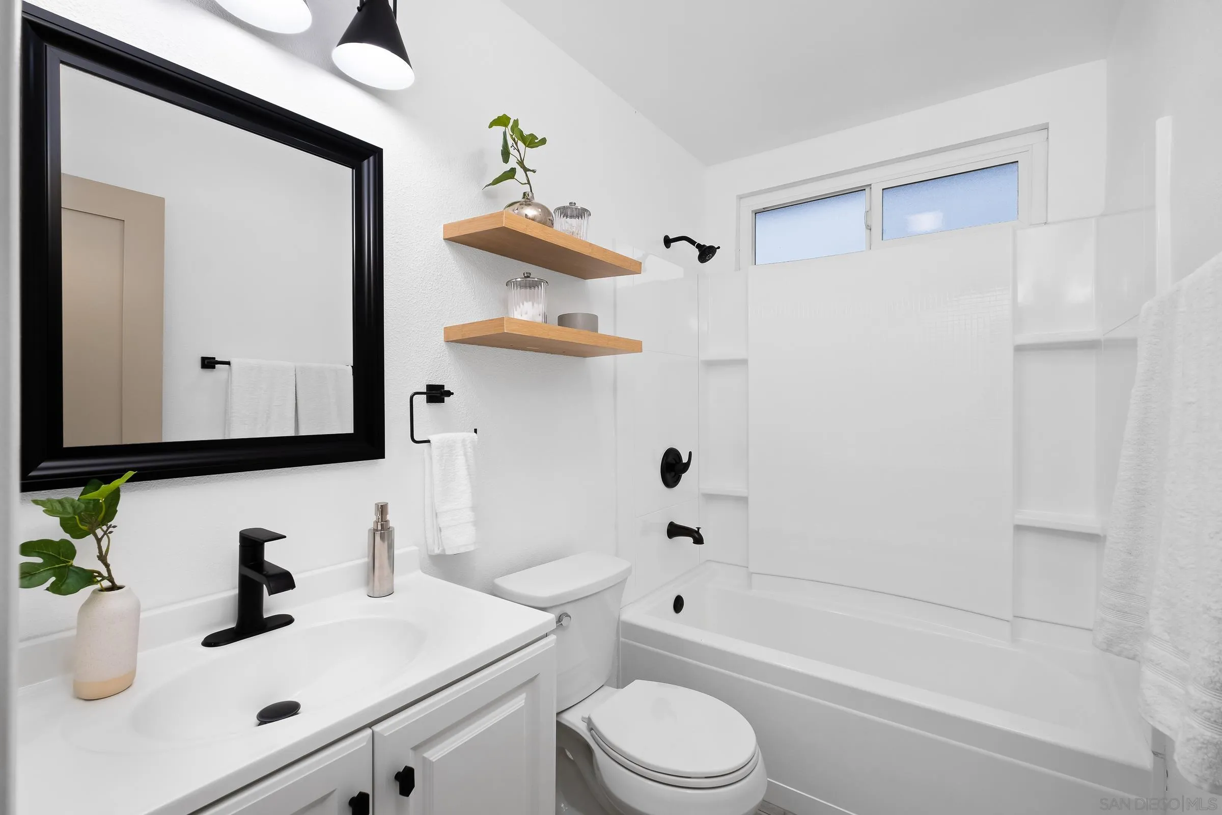 3757 Gail Drive Oceanside, CA 92056 - Photo 13 of 27 a bathroom with a sink a toilet and shower