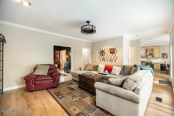 a living room with furniture and a rug